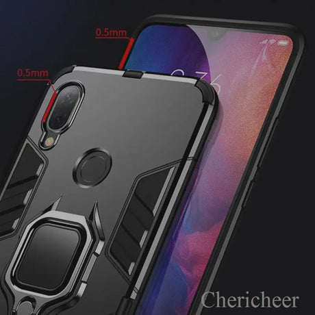 the back of a black iphone case with a ring holder