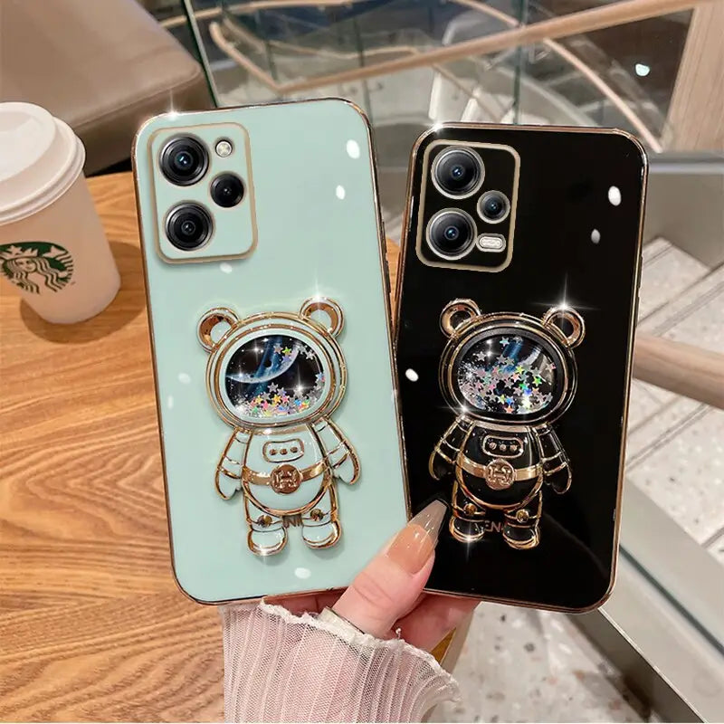a person holding a phone case with a bear and bear