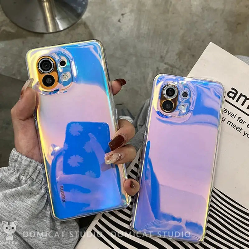 a woman holding a phone case with a blue and purple liquid liquid