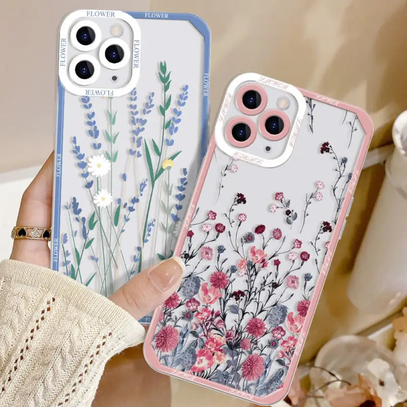 a woman holding a phone case with flowers on it