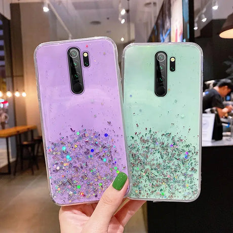two cases with glitter glitters on them
