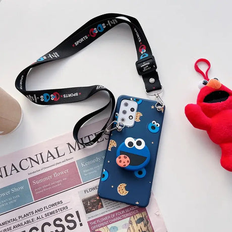 a cell case with a red heart and a red stuffed animal