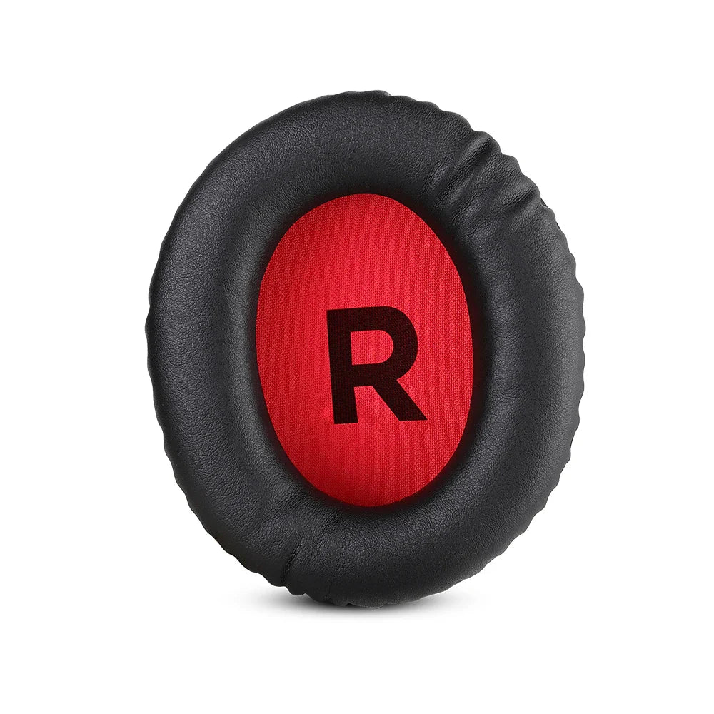 Circular black ear cushion with a red center displaying the letter ’R’.