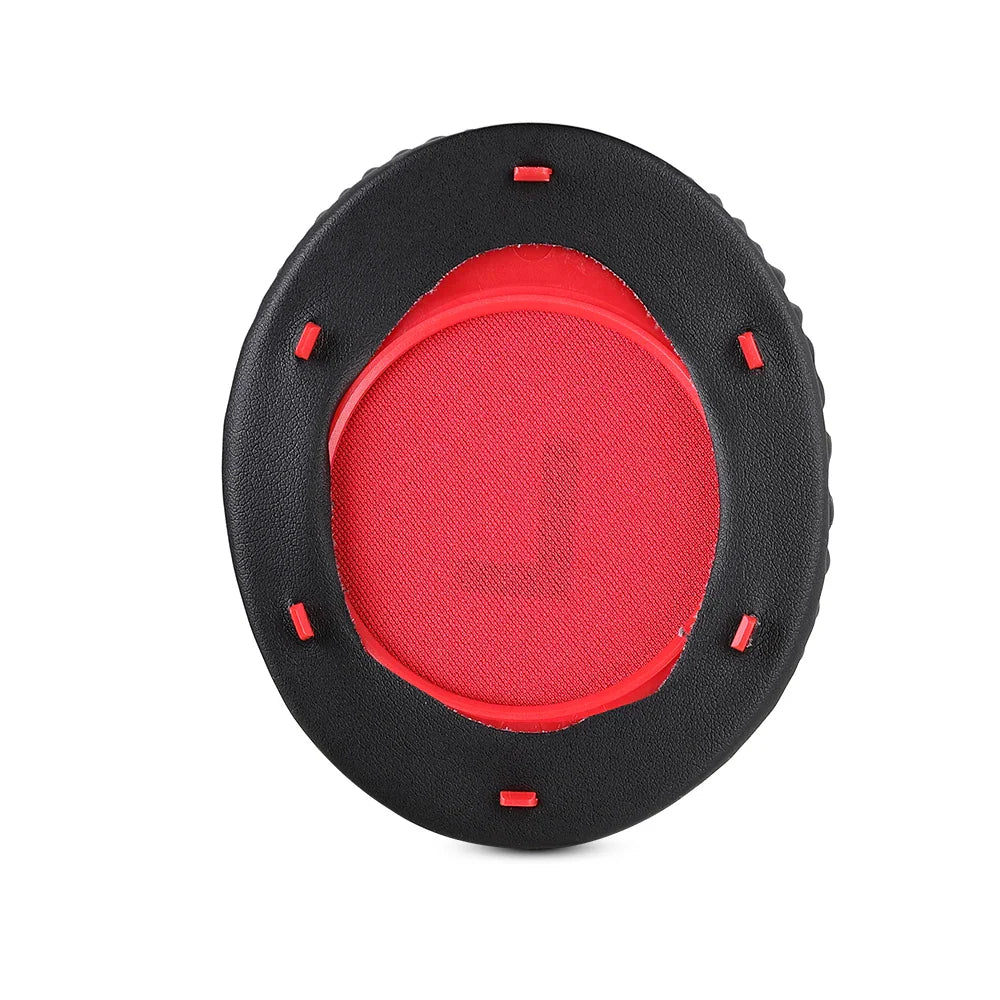 Circular ear cushion with a red center and black outer ring.