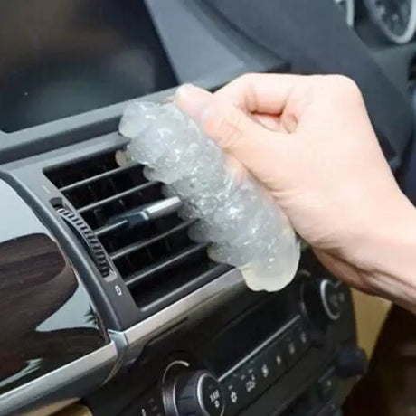 a person is opening the car door with a plastic bottle