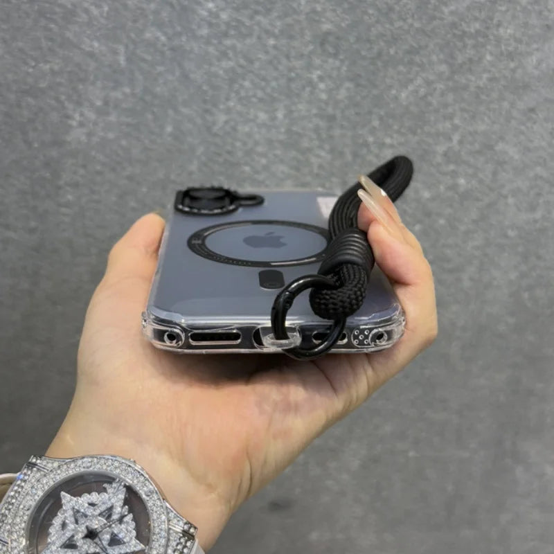 Clear iPhone case with a black lanyard attached, featuring a visible MagSafe ring.