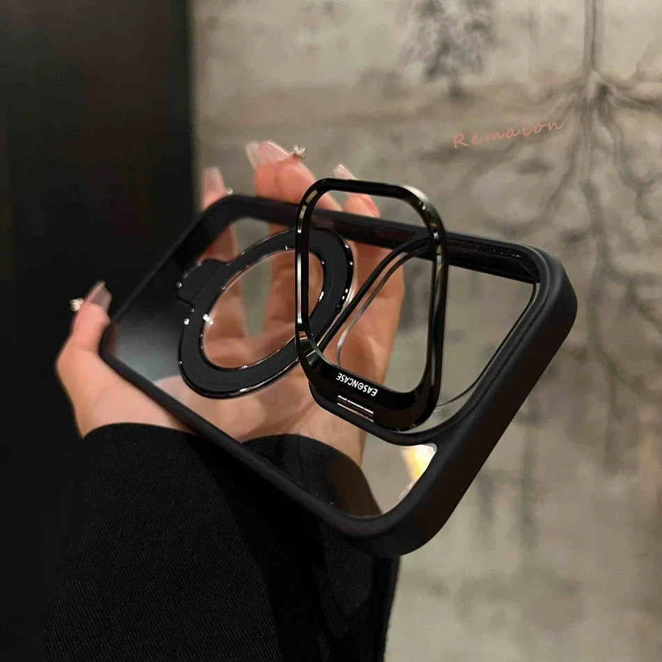 Clear phone case with black accents and a rotating ring stand.