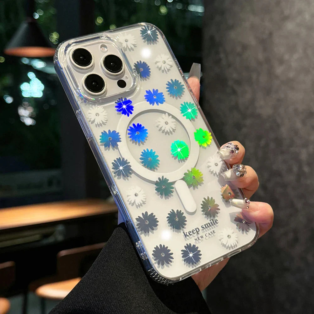Clear phone case with daisy pattern and MagSafe ring.