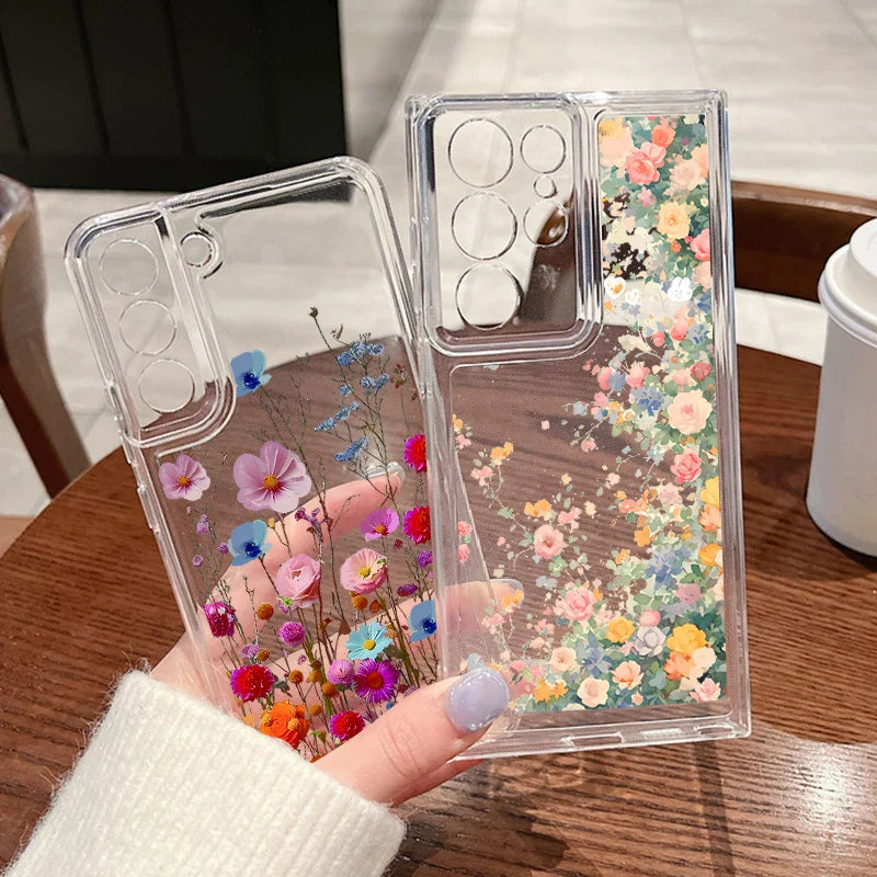 Clear phone case for samsung galaxy with embedded dried flowers in vibrant pink blue and orange on the back side