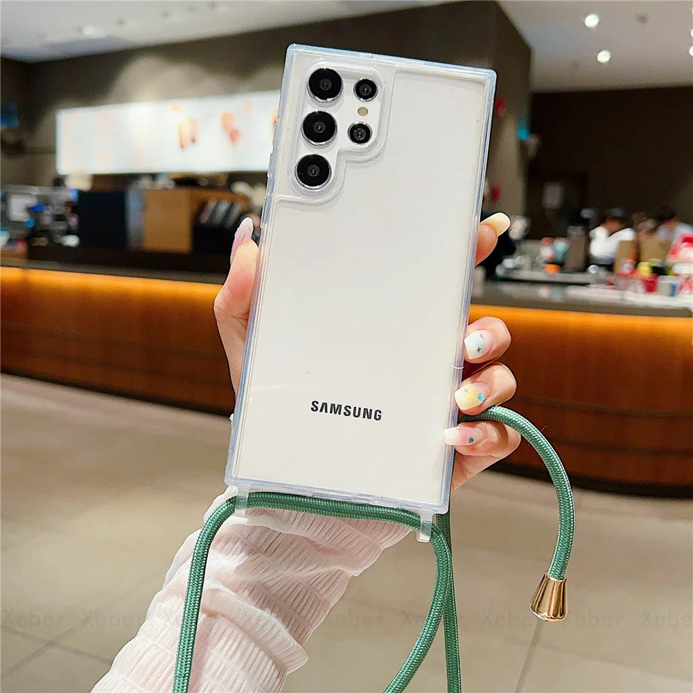 Clear phone case with a green lanyard for a Samsung phone