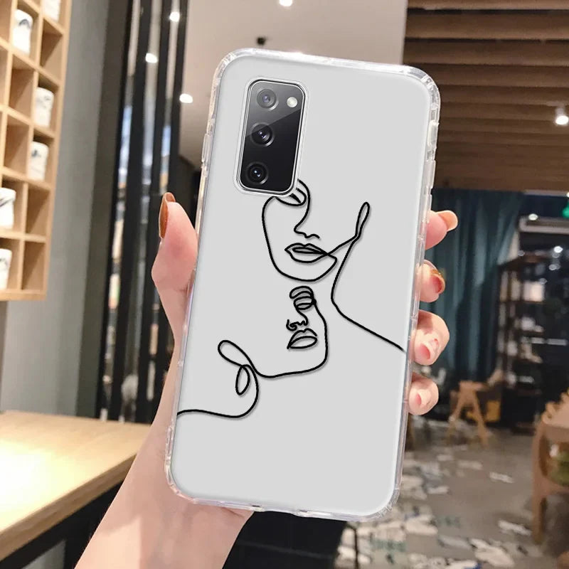 Clear phone case for samsung galaxy with minimalist black line art of two abstract faces on light gray background featuring abstract art design