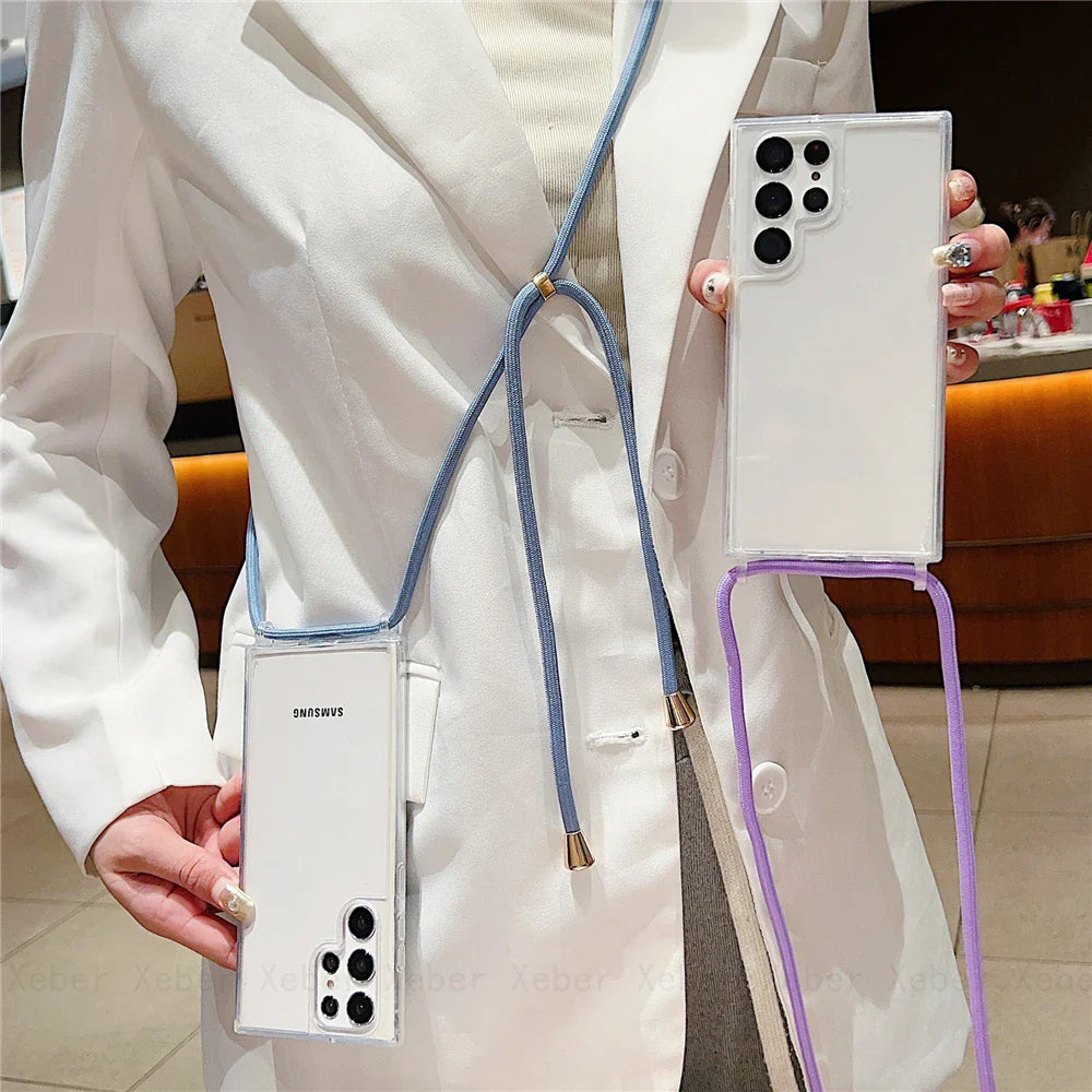 A clear smartphone case with a blue lanyard and a purple strap.