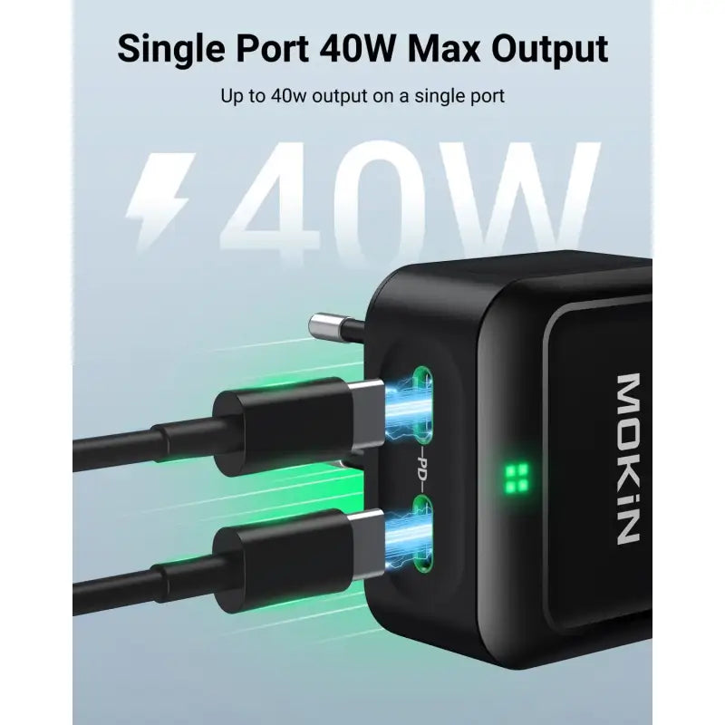 A close up of a black power adapter with a green light