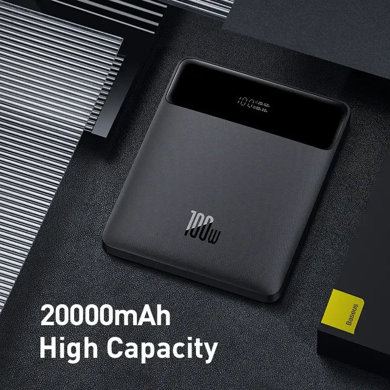 A close up of a black power bank with a yellow card
