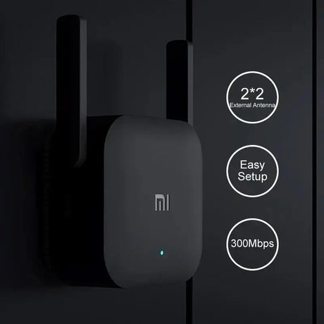 a close up of a black wall mounted wifi router