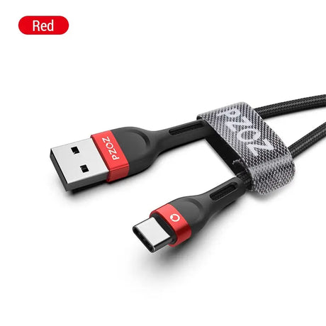 a close up of a usb cable connected to a red and black cable