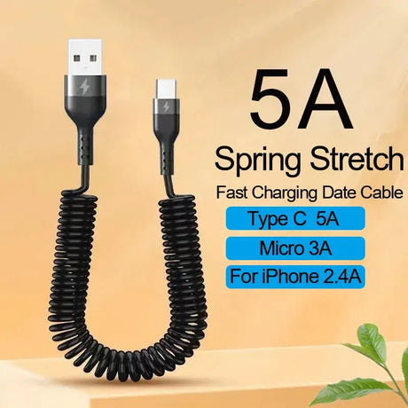 A close up of a cable connected to a phone with a plant in the background