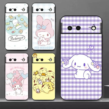 a close up of a cell phone with a bunch of cartoon designs
