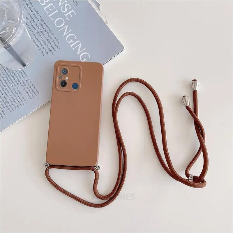 a brown leather case with a strap and a phone