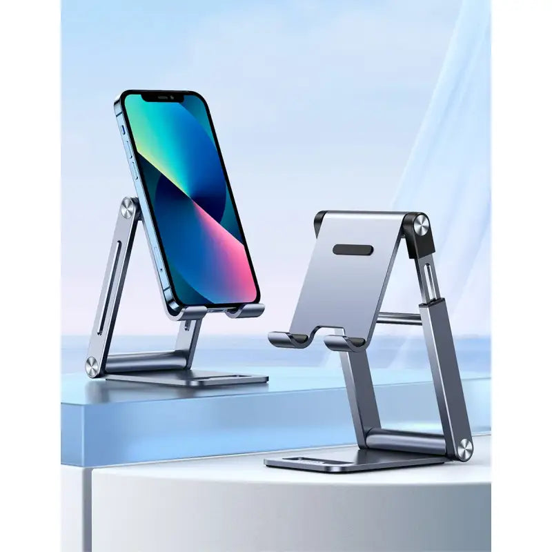 A close up of a cell phone on a stand on a table