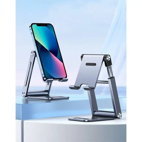 A close up of a cell phone on a stand on a table