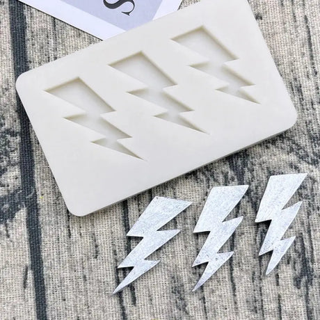 a close up of a cookie cutter with a number and a lightning bolt