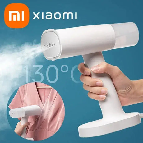 a close up of a person holding a handheld hair dryer