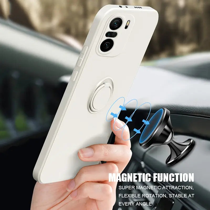 someone holding a cell phone in their hand with a magnet on it