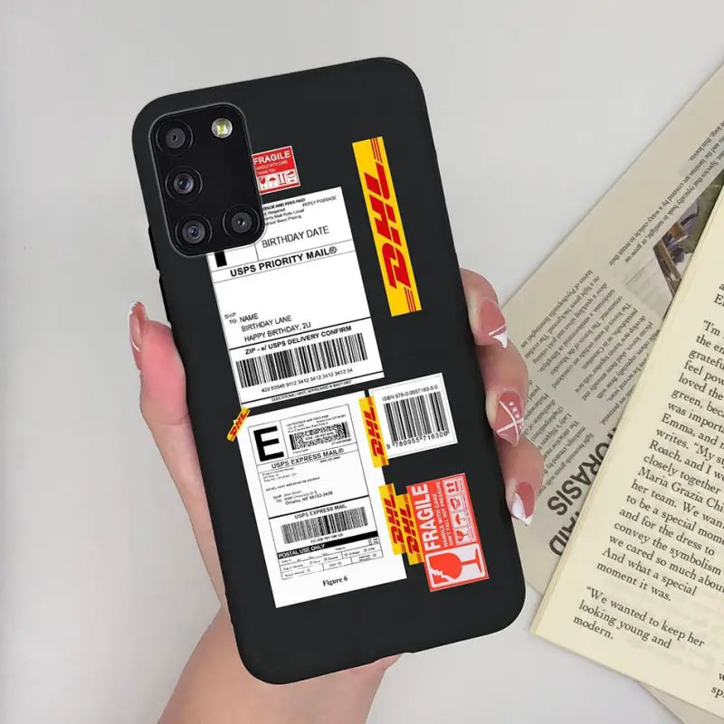 a woman holding a phone case with a ticket