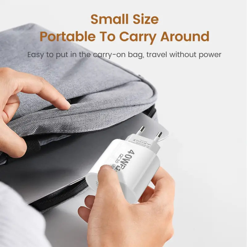 a person holding a small device in their hand