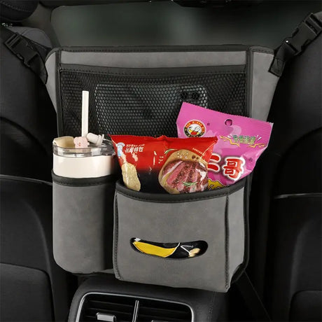 a close up of a car seat with a snack and drink in it
