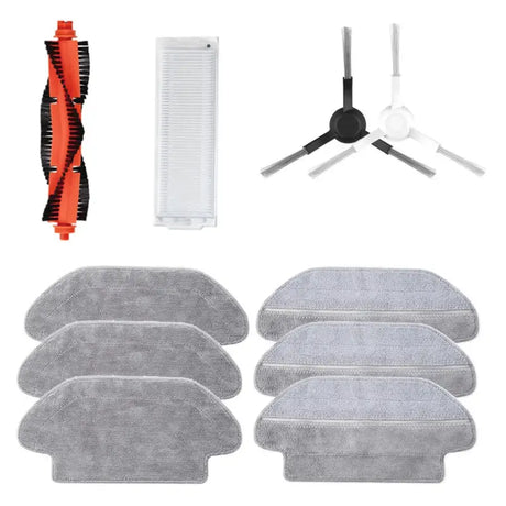 A close up of a set of cleaning supplies including a brush, cloth, and a comb