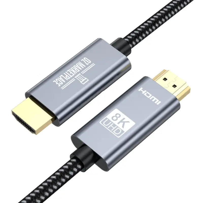 A close up of a usb cable with a black braid