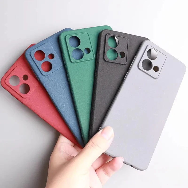 A collection of five silicone phone cases in red, blue, green, dark grey, and light grey.