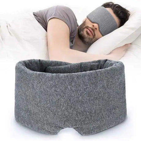 a man sleeping in bed with a pillow