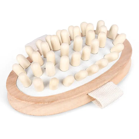 a wooden toy with white wooden pegs and a white cloth