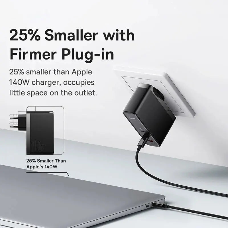 Compact black charger plug with a cable connected to a laptop.