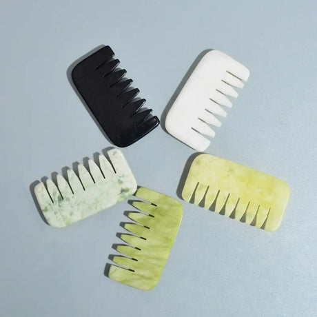 a set of four different colored plastic hair clips