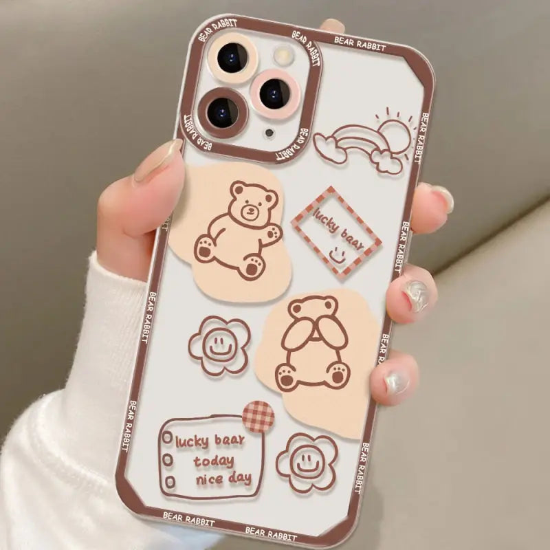 a woman holding a phone case with a cute cartoon design
