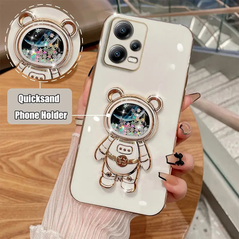 a person holding a phone case with a bear