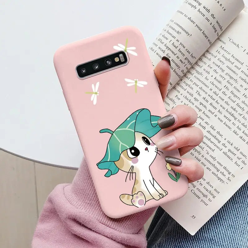 a woman holding a phone case with a cartoon character on it