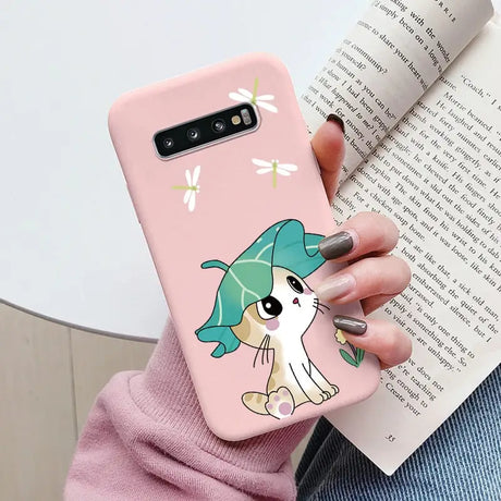 a woman holding a phone case with a cartoon character on it