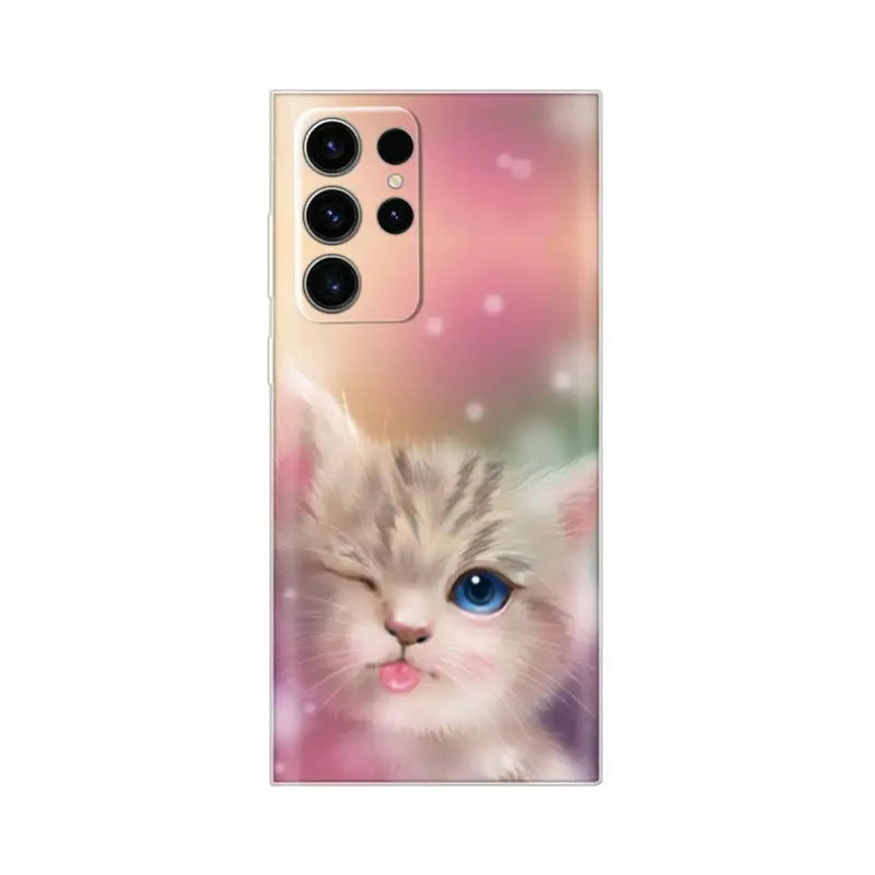 a cute kitten with blue eyes on a pink background