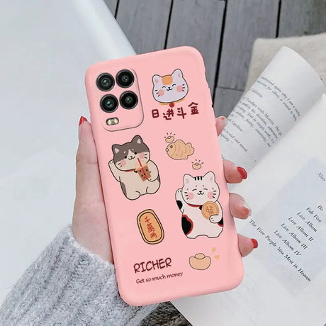 a woman holding a pink phone case with cartoon characters on it