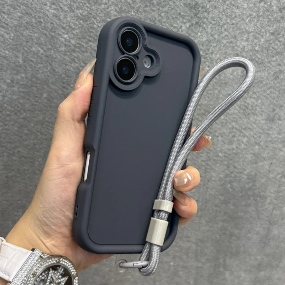 A dark gray smartphone case with a built-in camera lens protector and an attached light gray braided wrist strap.