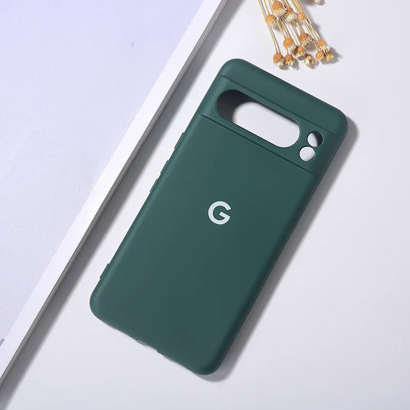 Dark green silicone phone case with a raised camera bar cutout and βGβ logo.
