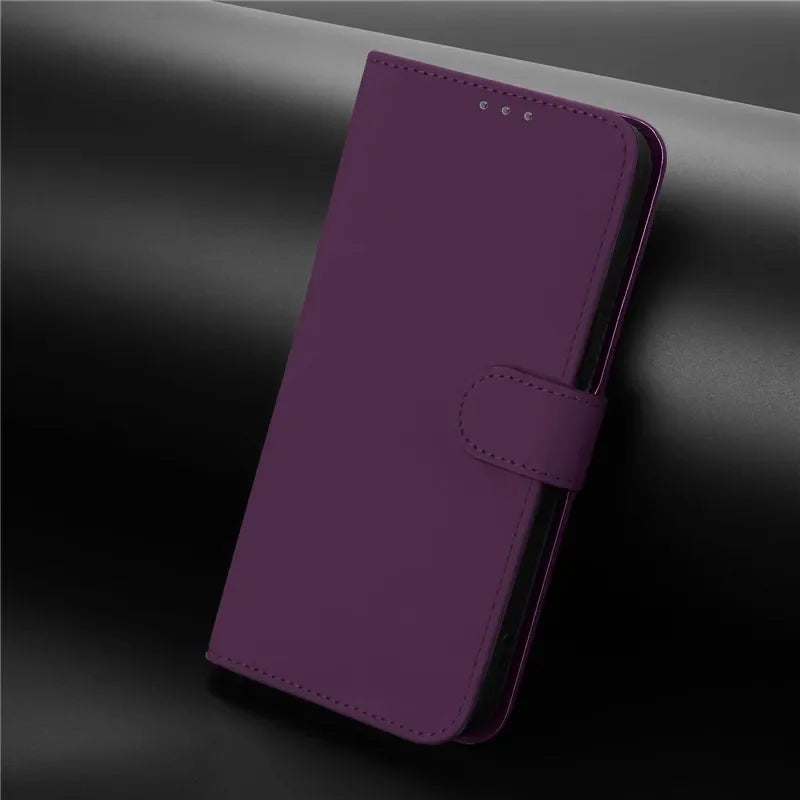 A dark purple faux leather flip phone case with a magnetic clasp.