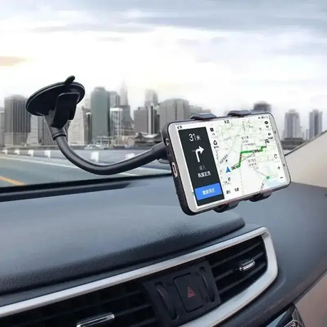 a car dashboard with a phone in the middle