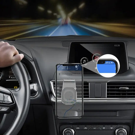 arafed view of a person driving a car with a cell phone in the dashboard