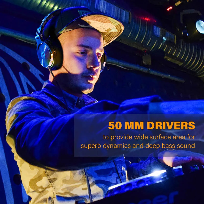DJ wearing headphones and a cap while operating equipment in a blue-lit environment.